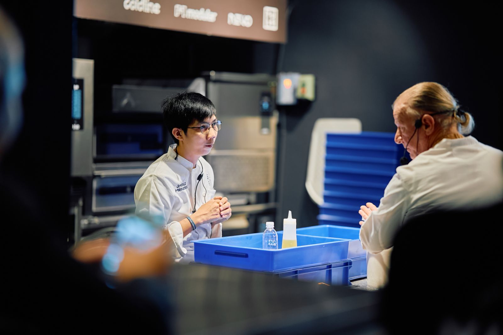 International chefs consulting in a professional kitchen